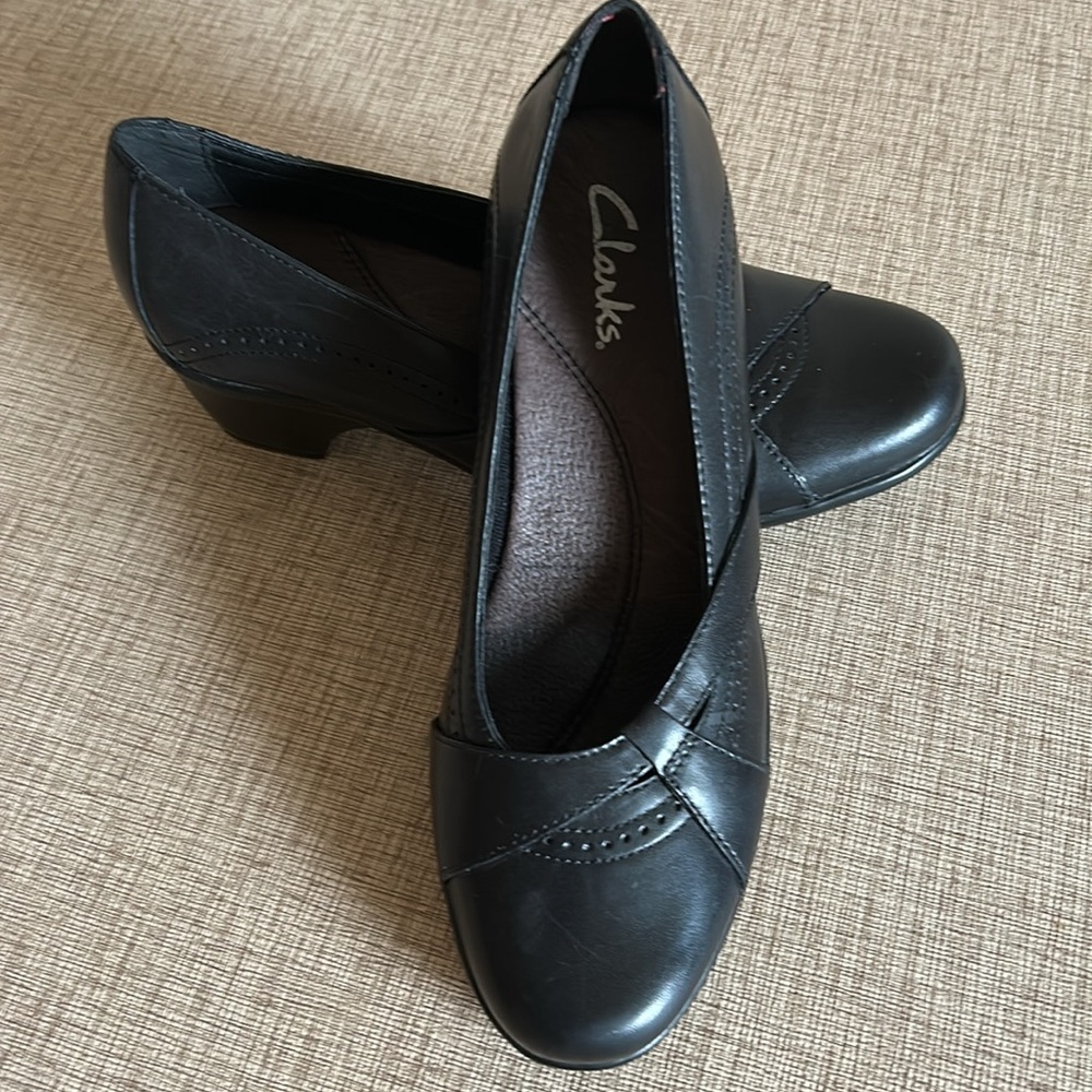 Clarks black leather loafers with 1 1/2 inch heel.  Like new condition. Size 7